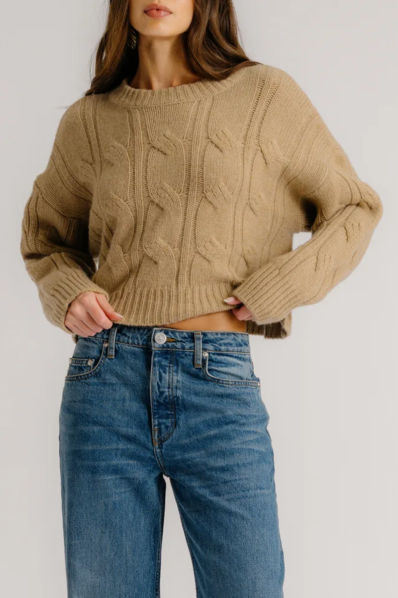front profile model wearing Tristan Crewneck Cable knit sweater Camel cashmere