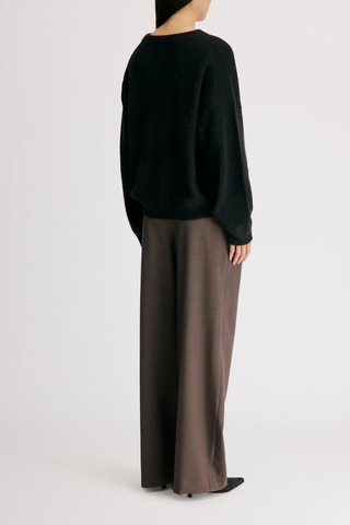back profile model wearing Tristan Soft Yak Crew Sweater Black Mercerized yak blend
Loose fit
Crew neck
Drop shoulders
Thick ribbing along the neckline, cuffs and hem
50% Wool, 40% Yak, 10% Polyamide