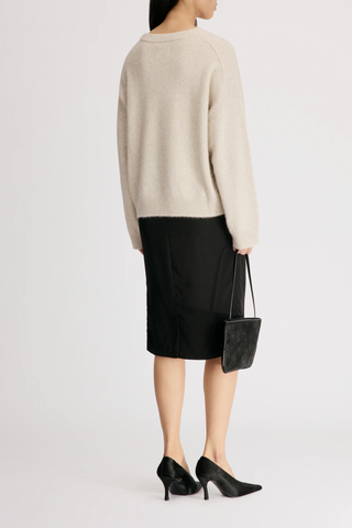 back profile model wearing Tristan Soft Yak Crew Sweater Stone M cream Mercerized yak blend
Loose fit
Crew neck
Drop shoulders
Thick ribbing along the neckline, cuffs and hem
50% Wool, 40% Yak, 10% Polyamide