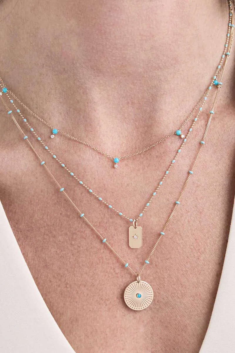 model wearing Turquoise Sunbeam Medallion Necklace 14k gold