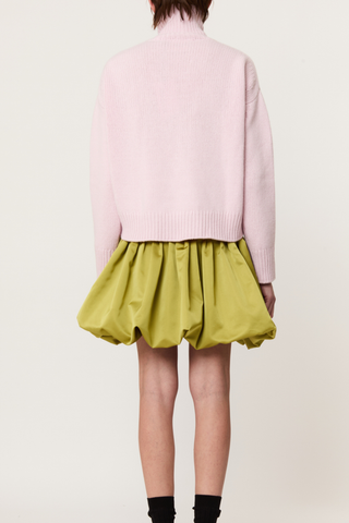 back profile model wearing  Turtleneck Sweater pink Pastel pink turtleneck sweater
Wool-cashmere blend
Relaxed fit
Dropped shoulders
Ribbed detailing on the collar, cuffs, and hem
70% Wool knit 30% Cashmere knit