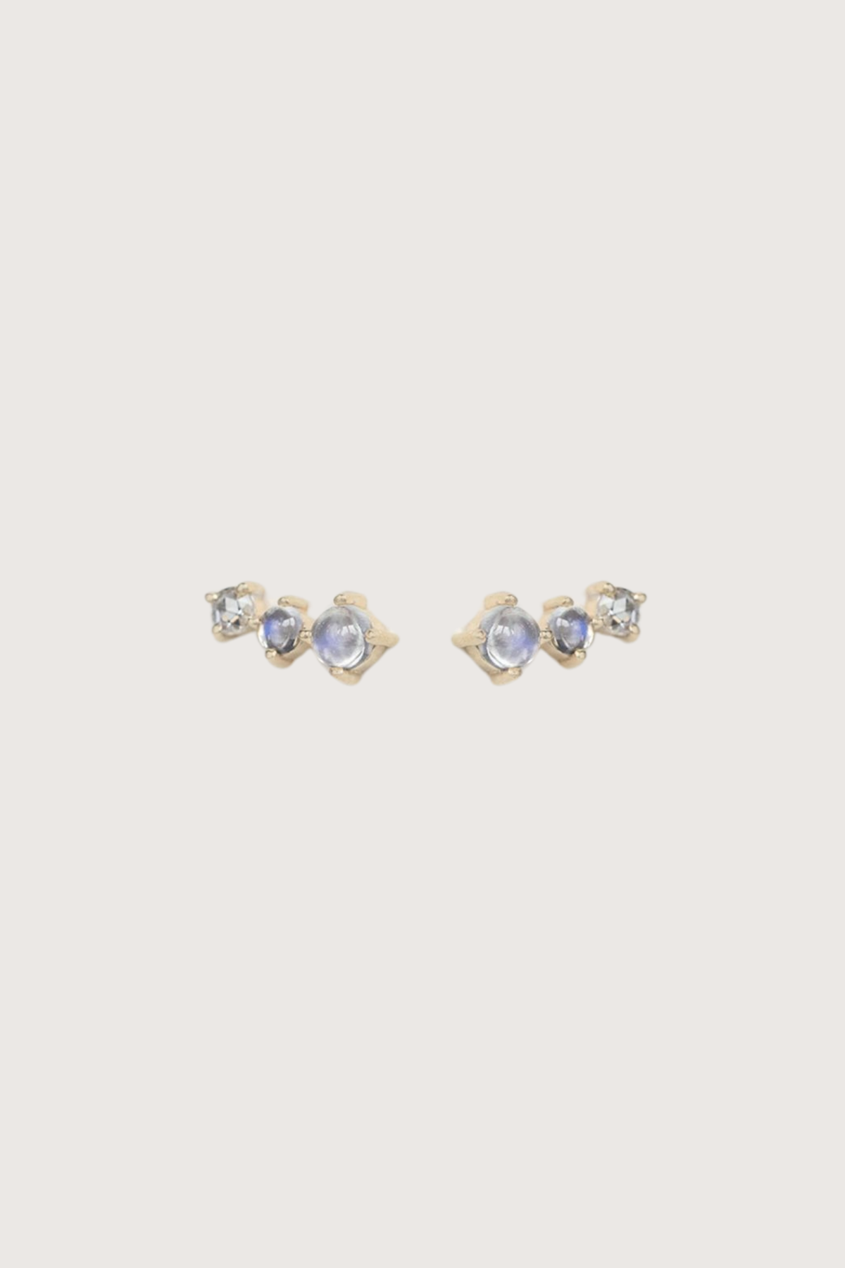 flat lay Two Moonstones and Rose Cut Diamond Earring 14k light yellow gold earrings
Two moonstones
One rose cut diamond
The stones come in a gradient of light iridescent tones