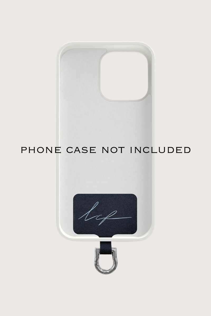 universal adapter with phone case model demonstration Universal Adapter Silver 
Fits discreetly into your existing case
A removable carabiner protrudes slightly from the charging connector, making it easy to attach your chain
Made of square black branded fabric with a stainless steel coating