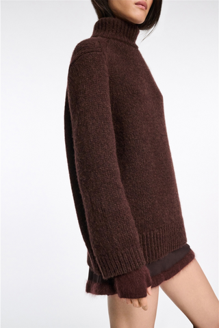 side profile model wearing Urban T-NK Favorites Sweater Dark Chocolate brown turtleneck long fit Double layer ribbed knit,
Shoulder seams angle to the front