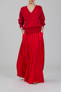 model front profile wearing  V-Neck Cashmere Sweater  vivid red 100% Cashmere
Deep V-neckline
Ribbed cuffs and hem
Fluid drape