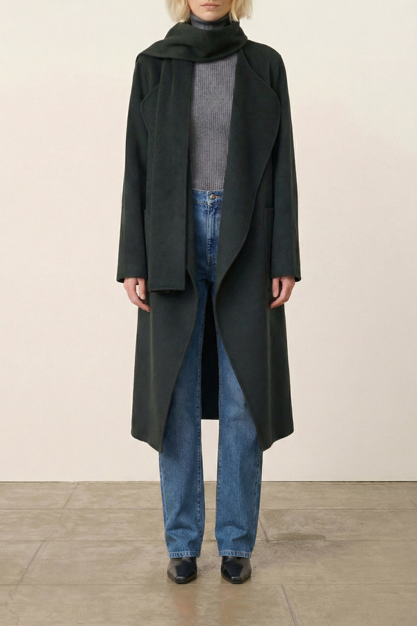 front profile model wearing Valeran Coat With Scarf vert green Long length coat
Removable scarf 
Removable belt
Asymmetrical panels allow
Patch pockets at the front
Large slits at the sides
80% Wool 20% Polyamide