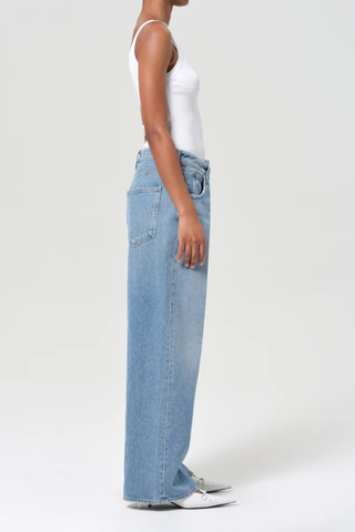 side profile model wearing Vana Fold Jean mantra light blue cotton Marbled vintage indigo wash
Fold-over detail at the waist
Classic five-pocket construction
Sculptural twist on a laid-back shape
Non stretch, weightless 100% cotton denim
Washed down for a super soft feel
Drapes effortlessly
Clean structure