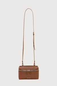 front profile Vanity Crossbody Bag tan 
Top handle
Removable crossbody strap
Microsuede lining
Top handle functionality
Zip closure
100% Calf Leather