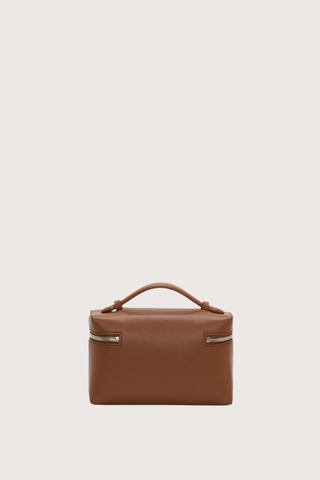 back profile Vanity Crossbody Bag tan 
Top handle
Removable crossbody strap
Microsuede lining
Top handle functionality
Zip closure
100% Calf Leather