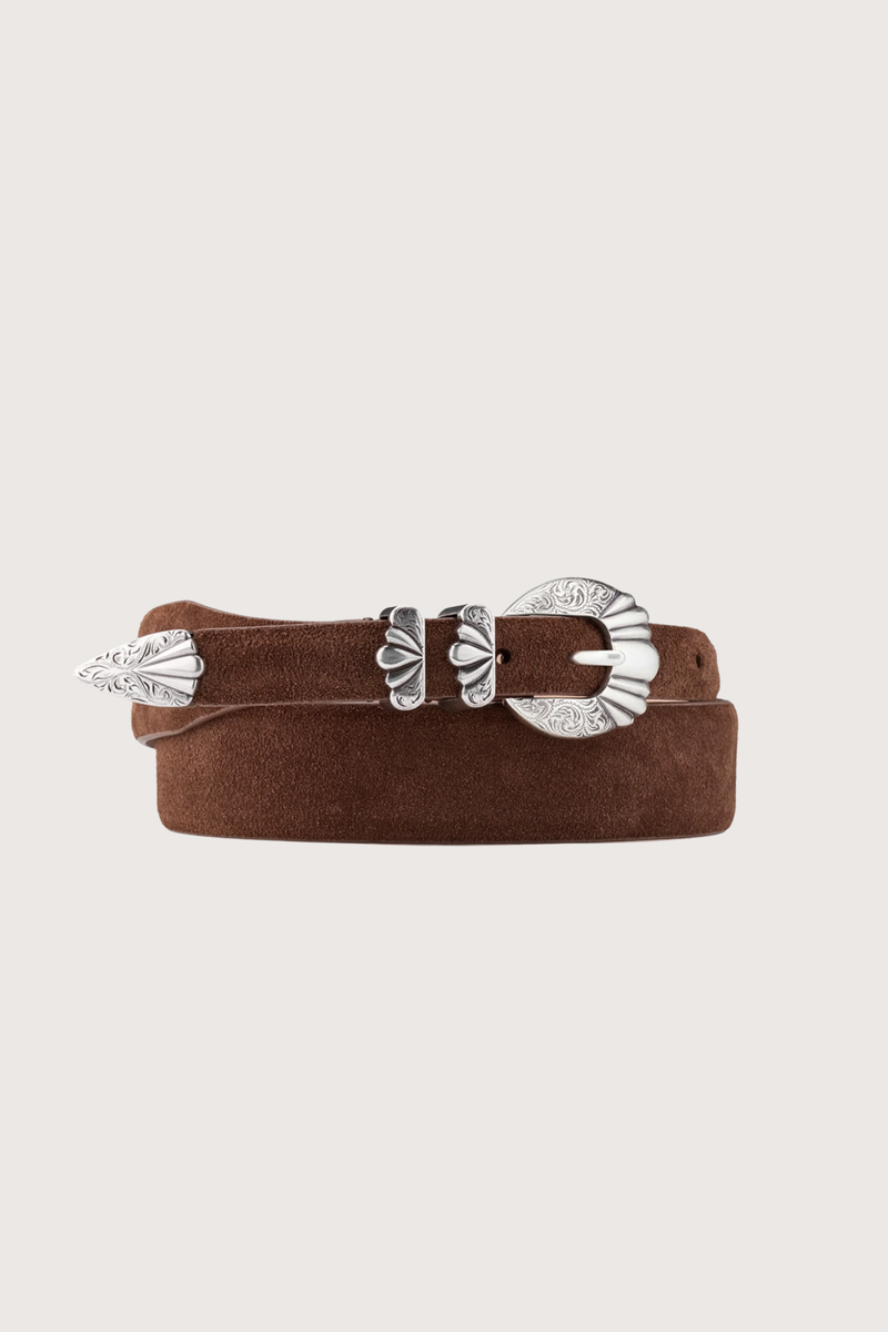 close up coiled Versailles Brown Suede Belt Hand-worked tapered silhouette, gradually shifting from 3.6 cm to 2 cm
4-piece “Versailles” buckle in an antique silver finish
100% suede
Solid brass hardware
Buckle: 2 cm
Height: 3.6 cm to 2 cm