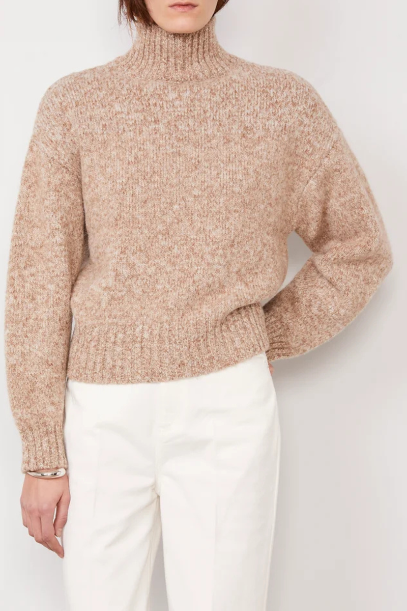 front profile model wearing Vesna Marl Fuzzy T-Neck Sweater beige cream Long-sleeve
Turtleneck
Dropped shoulders
Regular fit