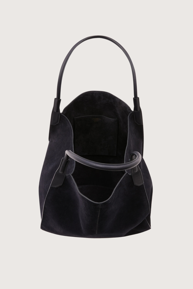 open inside view of Victoria Suede Tote Bag navy Tonal suede lining, leather strap
Internal flat pocket
Suede, 100% leather