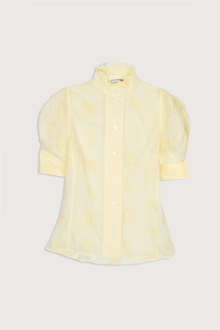 flat lay Vita Embroidered Voile Short Sleeve Top yellow Embroidery throughout
Puff sleeves
Ruched sleeves with thick cuffs
High collar with ruffles
Button front

Side slit
100% Cotton