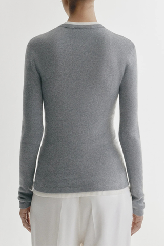 back profile model wearing Vivian Long Sleeve Ribbed T-Shirt Cloud grey Knitted long-sleeve T-shirt
Fine single rib knit cashmere blended with cotton
Fitted, hip-length silhouette
Round neck
Full-length sleeves
Straight hem
70% Cotton, 30% Cashmere