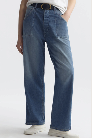 front profile model wearing Whitney Denim Pant delancey medium wash Japanese non-stretch light-weight denim
Relaxed from waist through leg
Sit low on hips
Elongated inseam
Full break
Patch pockets at back
Stitch-thru pockets at front