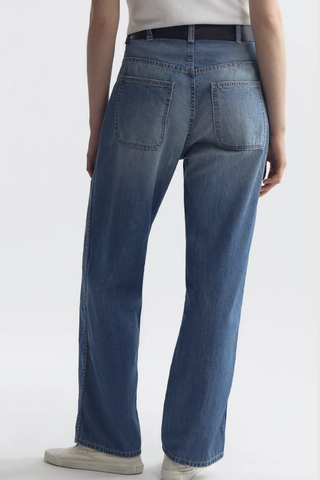 back profile model wearing Whitney Denim Pant delancey medium wash Japanese non-stretch light-weight denim
Relaxed from waist through leg
Sit low on hips
Elongated inseam
Full break
Patch pockets at back
Stitch-thru pockets at front