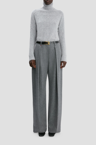 front profile model wearing Wide Leg Trouser grey melange Fluid cashmere jersey wide leg trouser with pleating detail High rise Wide leg Side pockets