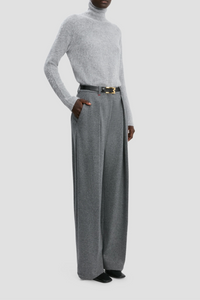 side profile model wearing Wide Leg Trouser grey melange Fluid cashmere jersey wide leg trouser with pleating detail High rise Wide leg Side pockets