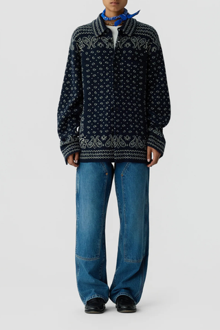 front profile model wearing Wild Rag Work overshirt Midnight blue Unisex 
Knit from mid-weight 100% cashmere
Relaxed fit
Classic shirt collar
Bandana print throughout
Chest patch pocket
Front button down closure
Button sleeve cuff with placket