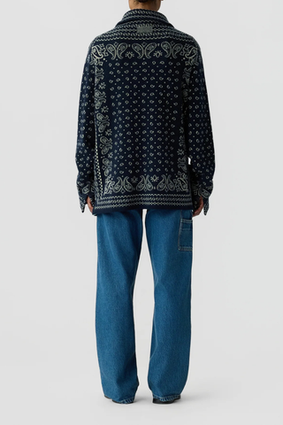 back profile model wearing Wild Rag Work overshirt Midnight blue Unisex 
Knit from mid-weight 100% cashmere
Relaxed fit
Classic shirt collar
Bandana print throughout
Chest patch pocket
Front button down closure
Button sleeve cuff with placket