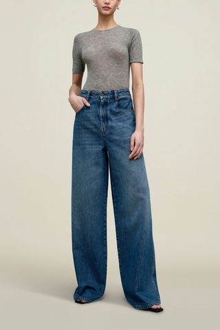 front profile model wearing Winona Wide Leg Jean Americana blue wash Extra wide leg, Fitted waist, relaxed fit, long rise, puddling bottom look