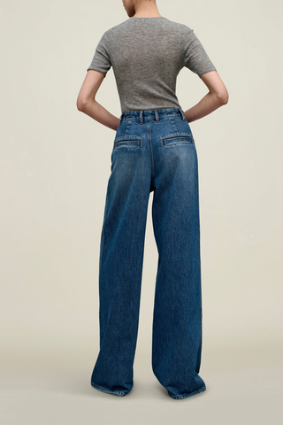 back profile model wearing Winona Wide Leg Jean Americana blue wash Extra wide leg, Fitted waist, relaxed fit, long rise, puddling bottom look