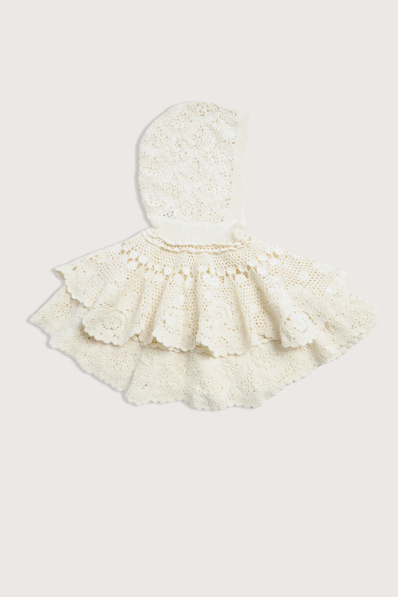 flat lay Wright Poncho cream Knit poncho
Hand crocheted
Tiered layers of intricate crochet
Create a dimensional, textural silhouette
Finished with a hood
100% wool

Slip on
Relaxed fit