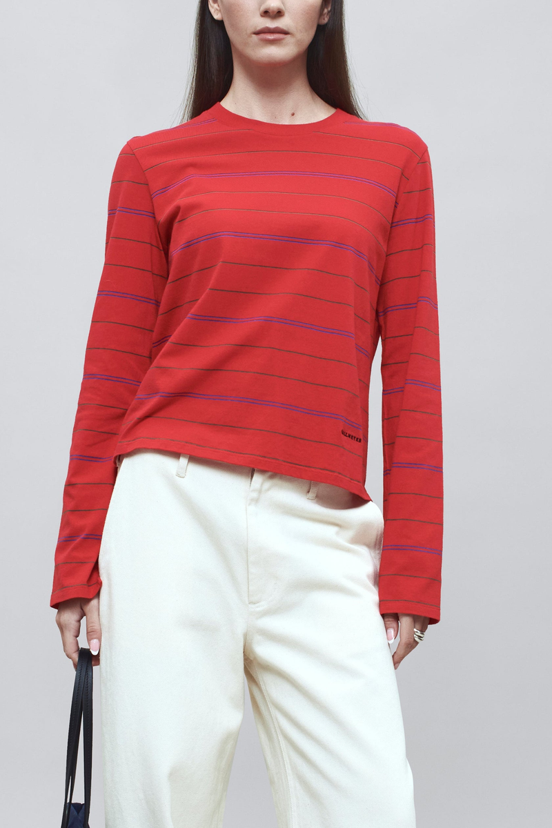 front profile model wearing Wynn Long Sleeve Stripe T- Shirt Crimson cotton Long sleeve t-shirt
Relaxed boxy fit
Subtle cropped length
Custom drawn stripe
Roomy sleeves
Slight taper at waist