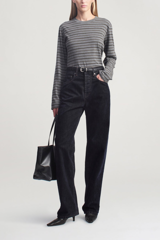 front profile model wearing Wynn Long Sleeve Stripe Tee Charcoal Stripe Long sleeve t-shirt
Relaxed boxy fit
Subtle cropped length
Custom drawn stripe
Roomy sleeves
Slight taper at waist
Unisex
Shifted side seams give a tailored look
Solid binding at neckline
Subtle tonal logo embroidery at hip
100% Cotton