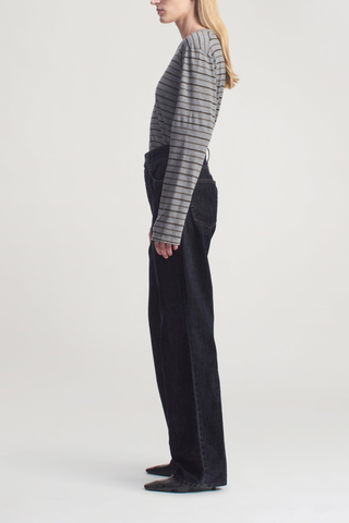 side profile model wearing Wynn Long Sleeve Stripe Tee Charcoal Stripe Long sleeve t-shirt
Relaxed boxy fit
Subtle cropped length
Custom drawn stripe
Roomy sleeves
Slight taper at waist
Unisex
Shifted side seams give a tailored look
Solid binding at neckline
Subtle tonal logo embroidery at hip
100% Cotton