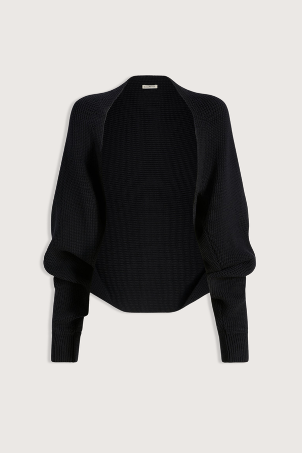 flat lay Yara Cotton Knit Shrug black Cropped shrug cardigan
Cotton knit
Open front with no closure
Ribbed detailing along the hem and cuffs
Relaxed, voluminous fit
Dropped seamless shoulders
Full sleeves