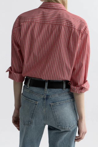 back profile model wearing Yorke Shirt In Stripe red white stripe Oversized button down
Italian cotton poplin
Buttoned center front placket
Sleeve cuff
Exaggerated shirt-tail hem &amp; body length
Garment-dyed