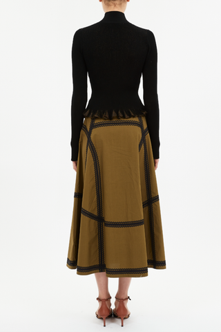 back profile model wearing Yulia Ruffle Turtleneck Top black Ruffled hemline
Sunburst knit with black and shimmering lurex yarns
slim fit
Turtleneck
Long sleeves