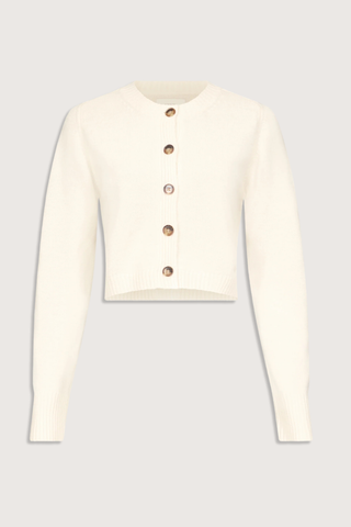flat lay Zephir Cardigan Ivory Cashmere
Cropped
Fitted silhouette
Long sleeves
Ribbed crew neck, hem and cuffs
Five button front