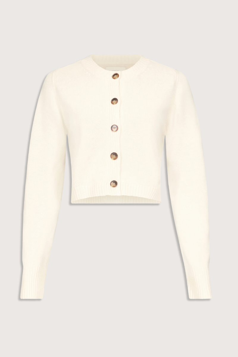 flat lay Zephir Cardigan Ivory Cashmere
Cropped
Fitted silhouette
Long sleeves
Ribbed crew neck, hem and cuffs
Five button front