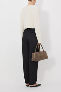back profile model wearing Zephir Cardigan Ivory Cashmere
Cropped
Fitted silhouette
Long sleeves
Ribbed crew neck, hem and cuffs
Five button front