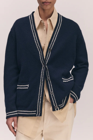 front profile model wearing The Stripe Trim V-Neck Cardigan navy white lambswool  White with Navy Stripe Trim
slouchy, oversized fit, v-neck, long sleeve
