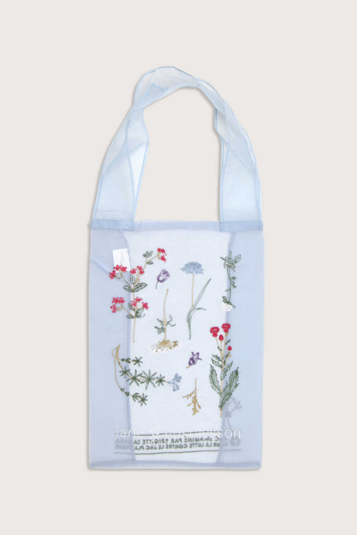 flat lay Sac tote bag Elle Blue Crafted from delicate organza
Embroidered herbarium and floral motifs
Lightweight
Subtle transparency