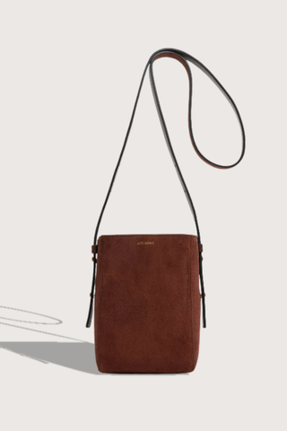 opposite side flat lay of  Parker M Long Strap Bag Marron Suede calfskin
Exterior pocket
Rectangle shape
Adjustable straps
100% Suede
Magnetic closure